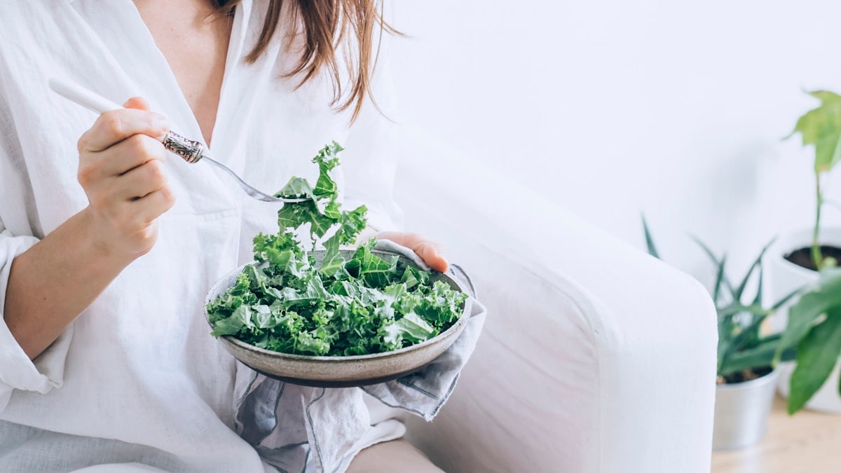 Woman Eating Healthy Kale Salad